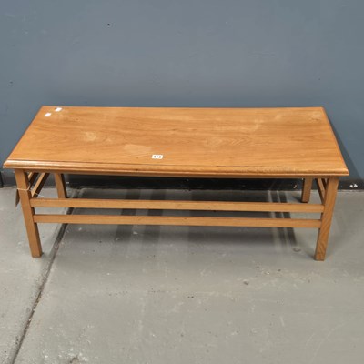 Lot 114 - A 1970s pine coffee table, the tapering square...