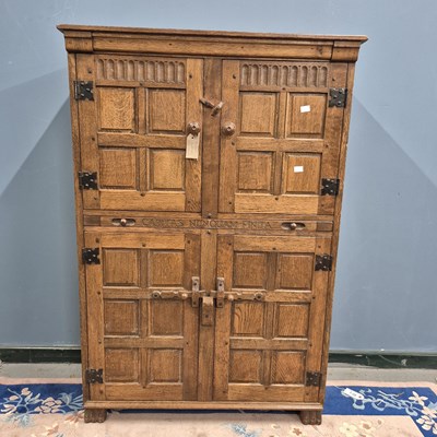 Lot 116 - An oak side cabinet with pairs of panelled...
