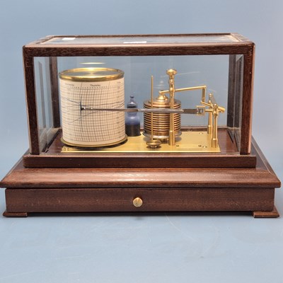 Lot 196 - A barograph in a bevelled glazed mahogany case...