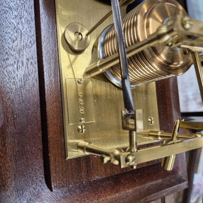 Lot 196 - A barograph in a bevelled glazed mahogany case...