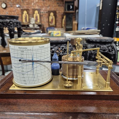 Lot 196 - A barograph in a bevelled glazed mahogany case...