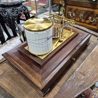 Lot 196 - A barograph in a bevelled glazed mahogany case...