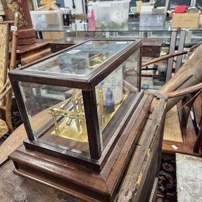 Lot 196 - A barograph in a bevelled glazed mahogany case...