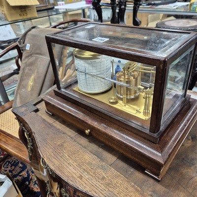 Lot 196 - A barograph in a bevelled glazed mahogany case...