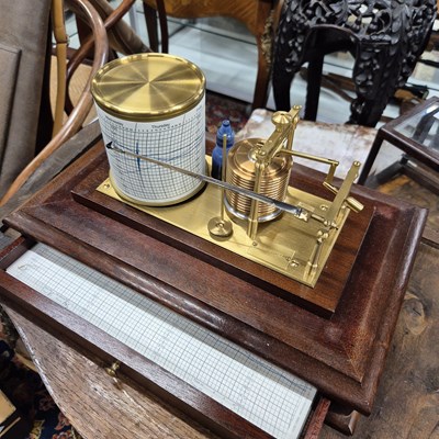 Lot 196 - A barograph in a bevelled glazed mahogany case...