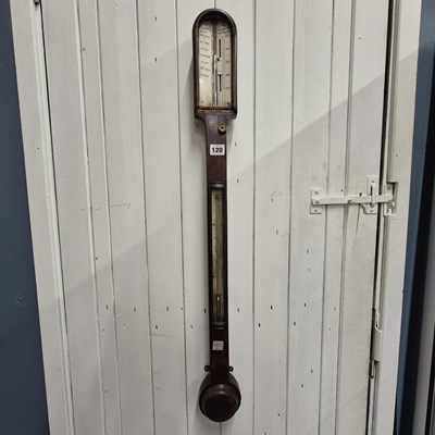 Lot 120 - A mahogany stick barometer applied with a...