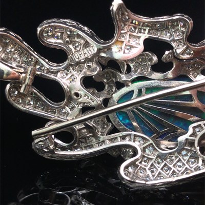Lot 81 - A boulder opal and diamond pendant brooch....