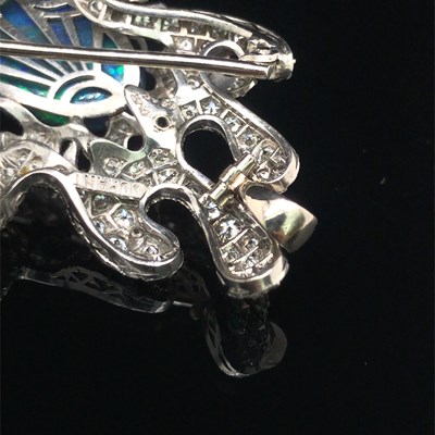 Lot 81 - A boulder opal and diamond pendant brooch....