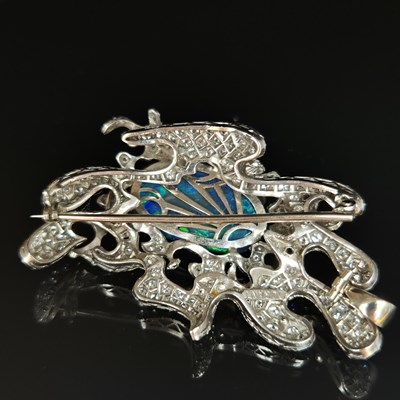 Lot 81 - A boulder opal and diamond pendant brooch....