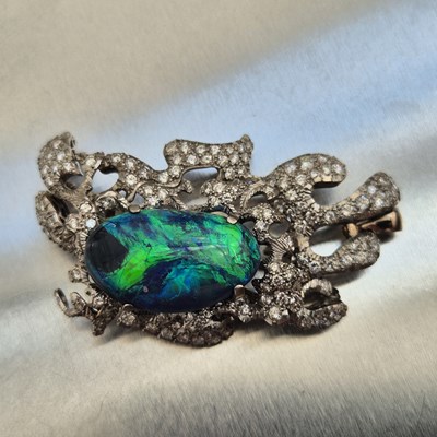 Lot 81 - A boulder opal and diamond pendant brooch....