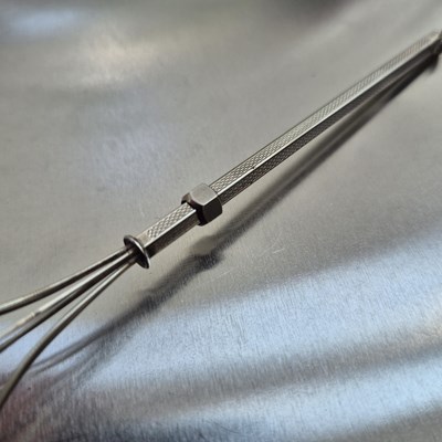 Lot 83 - A vintage swizzle stick stamped sterling...