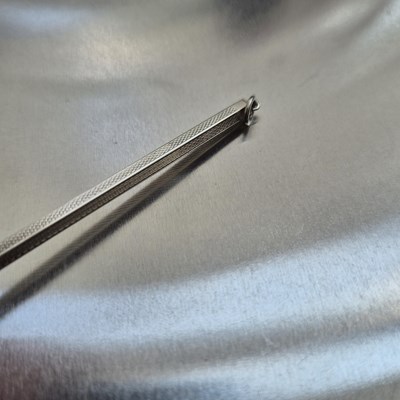 Lot 83 - A vintage swizzle stick stamped sterling...