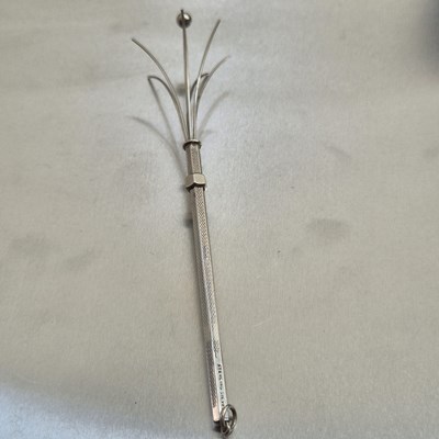 Lot 83 - A vintage swizzle stick stamped sterling...