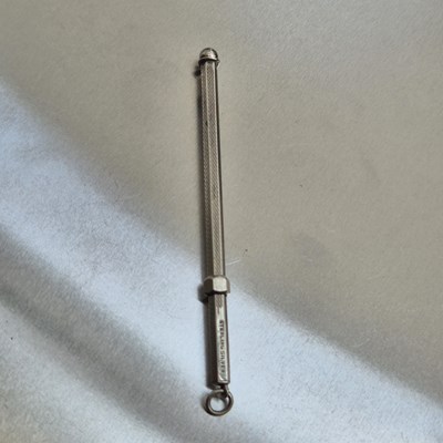 Lot 83 - A vintage swizzle stick stamped sterling...