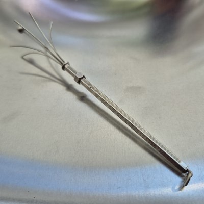 Lot 83 - A vintage swizzle stick stamped sterling...