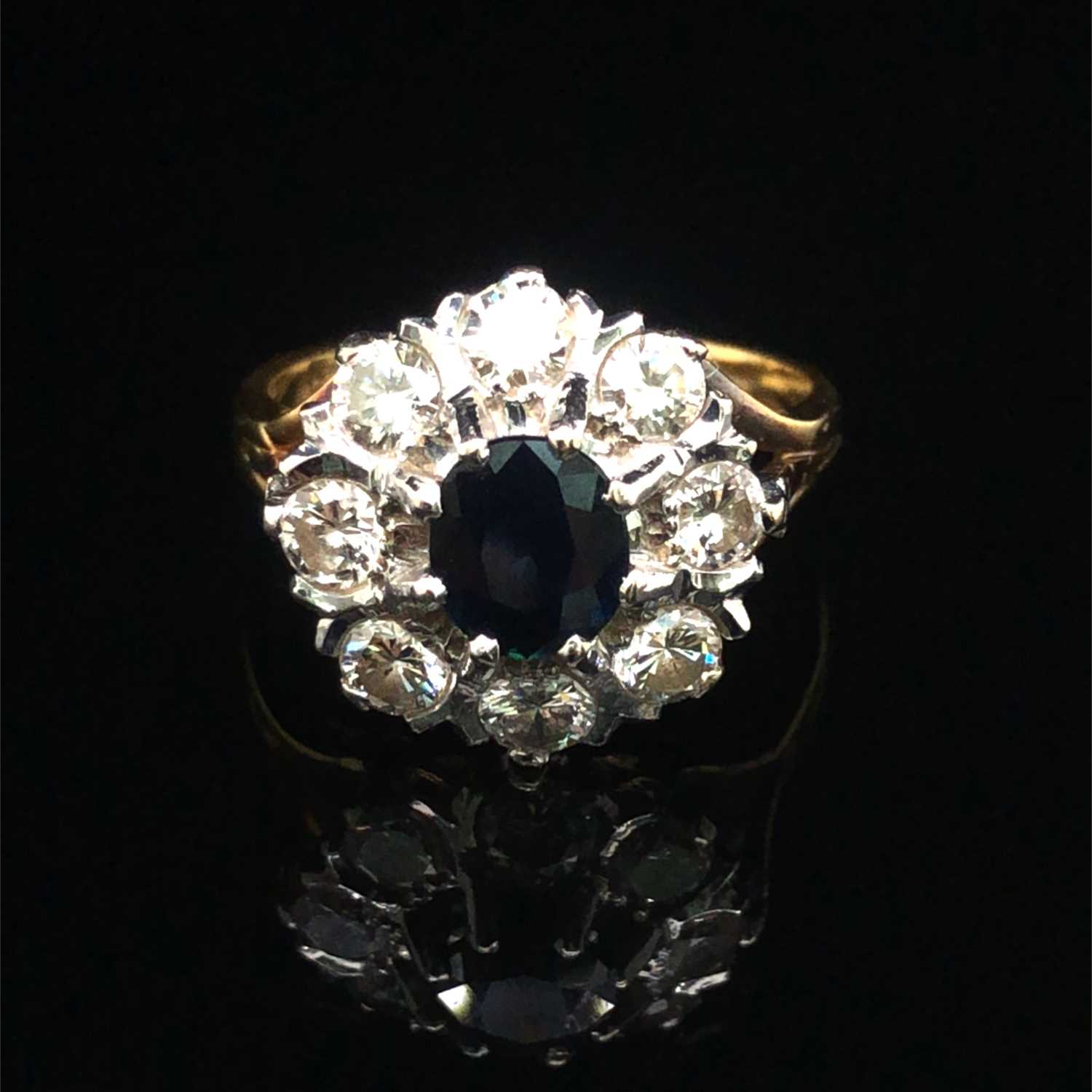 Lot 86 - A vintage sapphire and diamond cluster ring....