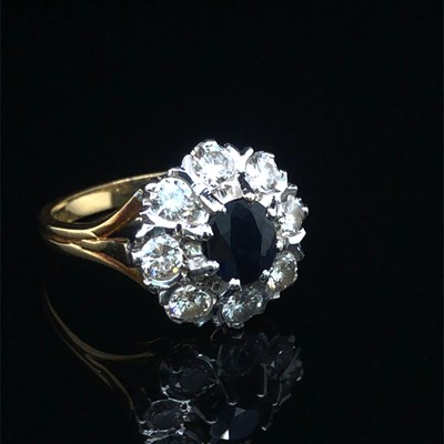 Lot 86 - A vintage sapphire and diamond cluster ring....
