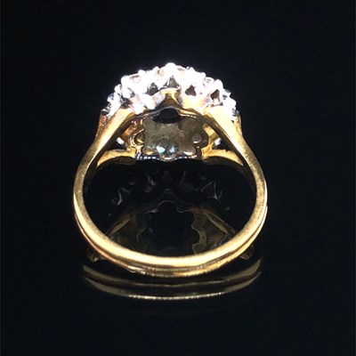 Lot 86 - A vintage sapphire and diamond cluster ring....