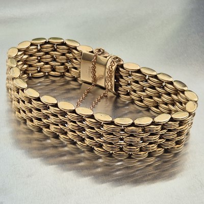 Lot 87 - A 9ct hallmarked gold fancy link wide bracelet...