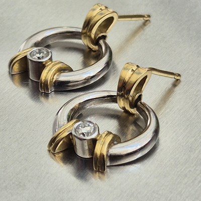 Lot 92 - A pair of contemporary diamond-set two-colour...