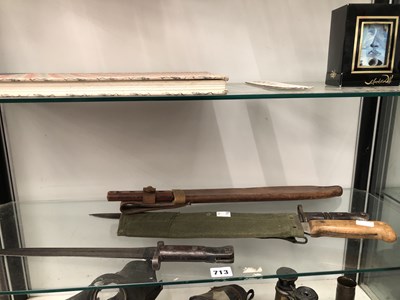 Lot 713 - Machetes, two bayonets, two gas masks, an...