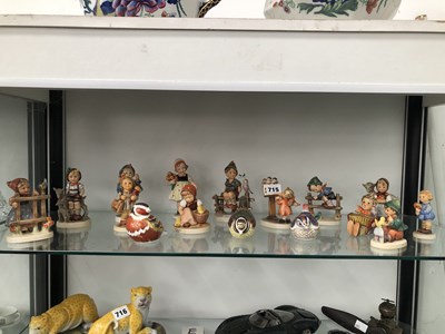 Lot 715 - Thirteen Hummel figures together with three...