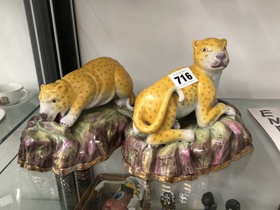 Lot 716 - A pair of Chinese porcelain reclining leopards