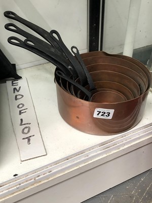 Lot 723 - A nest of seven copper saucepans