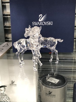 Lot 732 - A boxed pair of Swarovski foals together with...