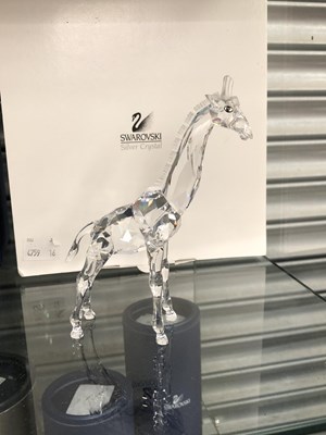 Lot 732 - A boxed pair of Swarovski foals together with...
