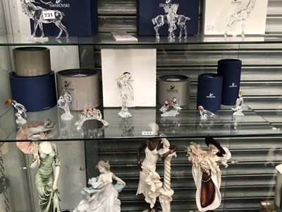 Lot 733 - A collection of seven Swarovski bird groups...
