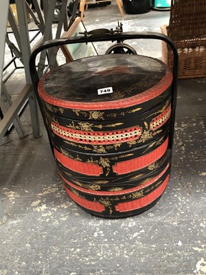 Lot 749 - A Chinese black and red lacquer nest of four...