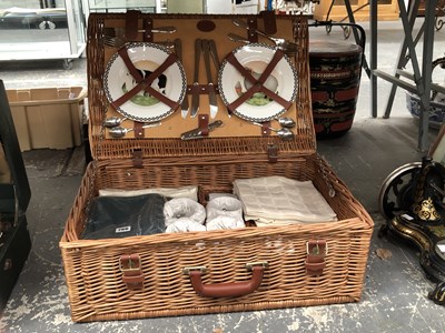 Lot 766 - A picnic basket fitted with four place settings