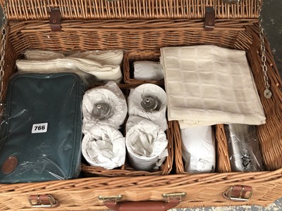 Lot 766 - A picnic basket fitted with four place settings
