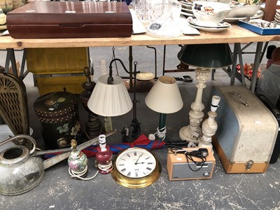 Lot 777 - Table lamps, a Technika radio, a wall clock,...