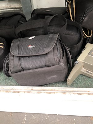 Lot 786 - Lumix and Nikon cameras, lenses and cases with...