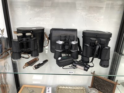 Lot 824 - Four cased pairs of binoculars together with...