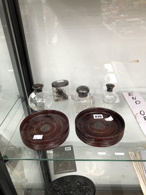 Lot 830 - A pair of mahogany wine coasters with central...