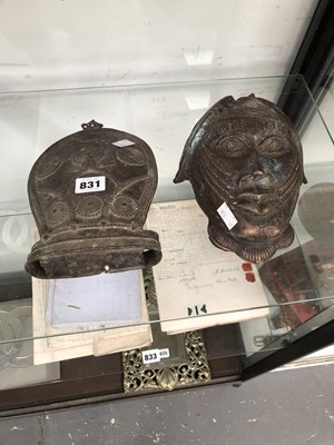 Lot 831 - A Benin bronze mask together with a bronze...
