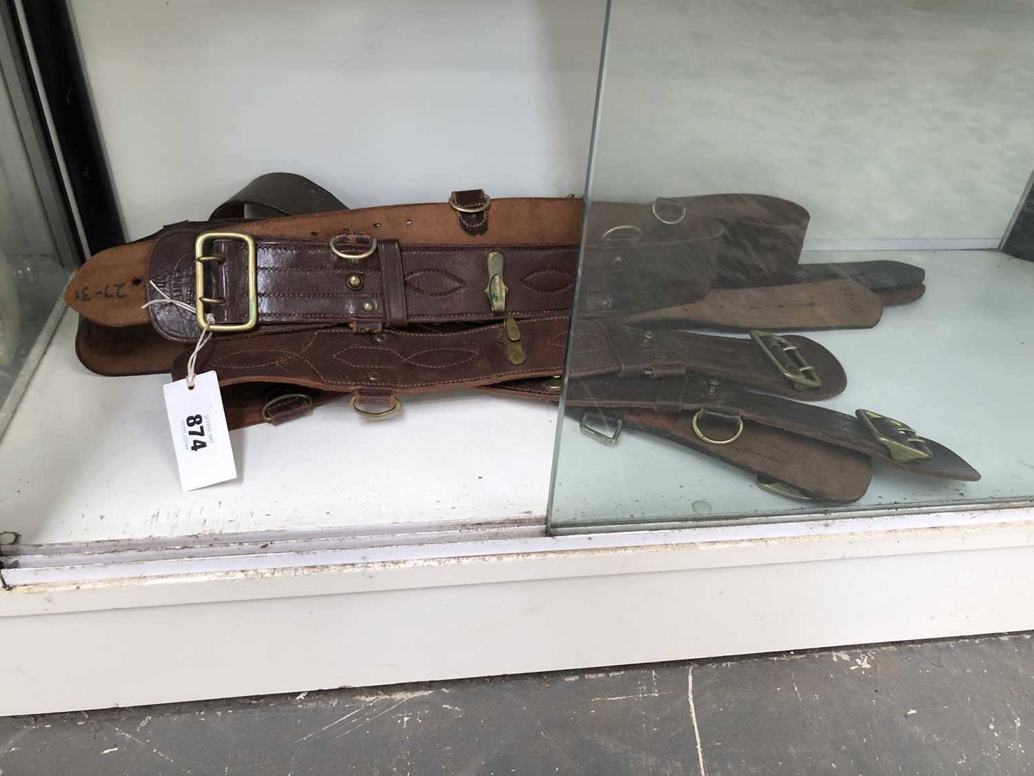 Lot 874 - A collection of brown Sam Browne type belts by...