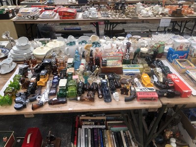 Lot 923 - A collection of Avon cosmetic bottles in the...
