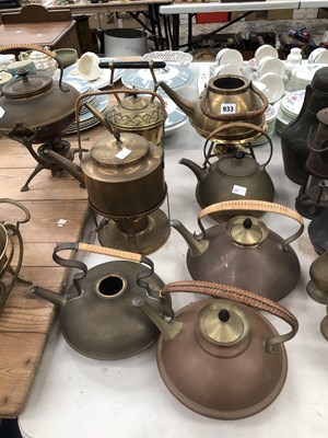 Lot 933 - A collection of brass and copper kettles some...