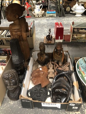 Lot 953 - A collection of tribal carved wood masks and...