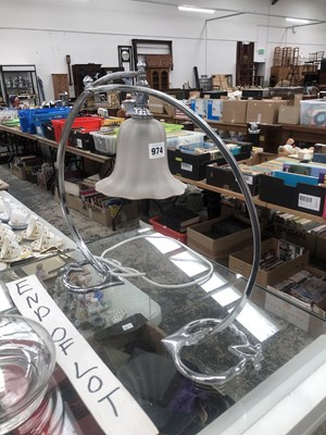 Lot 974 - A pair of chrome table lamps, one with a...