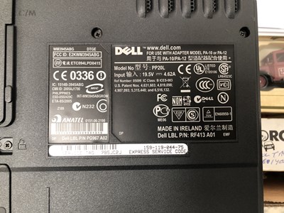 Lot 1093 - A cased Dell laptop with a CD and a microphone...