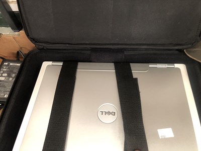 Lot 1093 - A cased Dell laptop with a CD and a microphone...