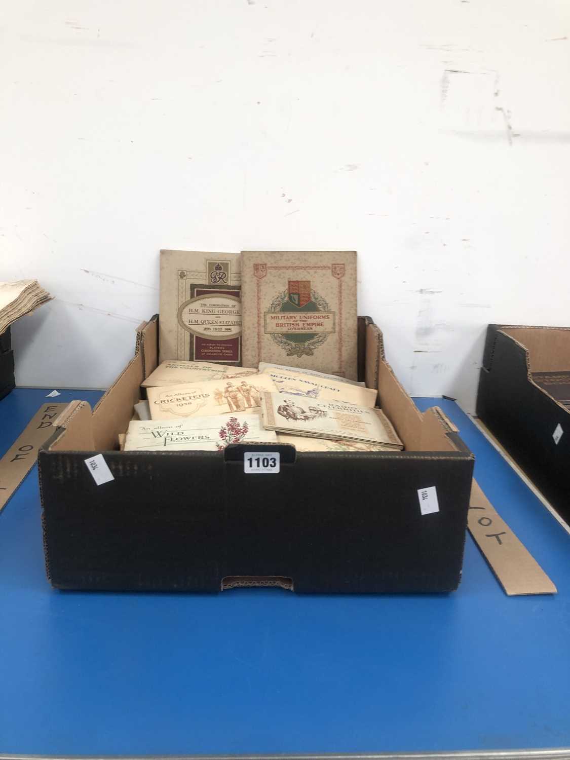 Lot 1103 - A large collection of cigarette cards in...
