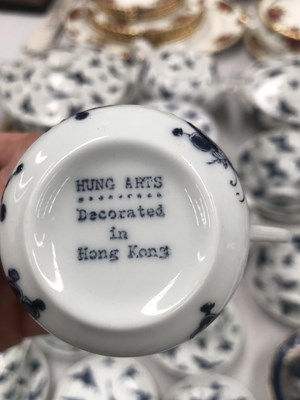 Lot 1147 - A blue and white service Hong Kong decorated...
