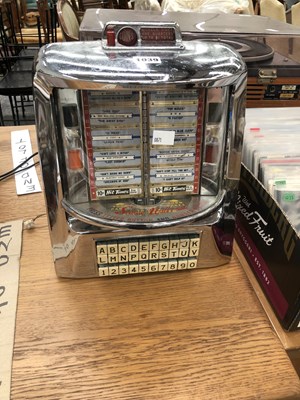 Lot 1039 - A Seeburg Wall-O-Matic table top juke box...