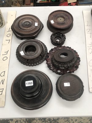Lot 1163 - Nine various hardwood vase stands
